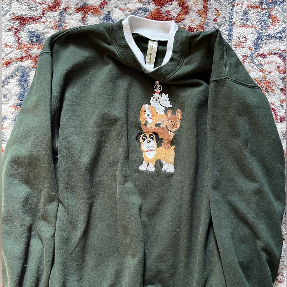 green crewneck sweater with dogs